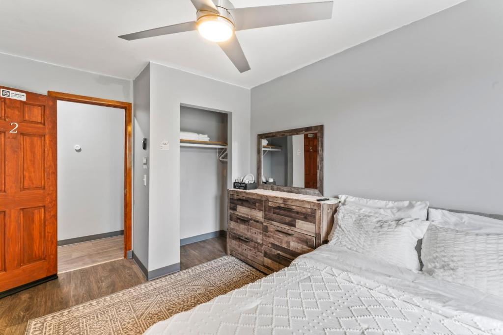 Two double beds with blue and yellow curtains, East 16th Avenue Anchorage