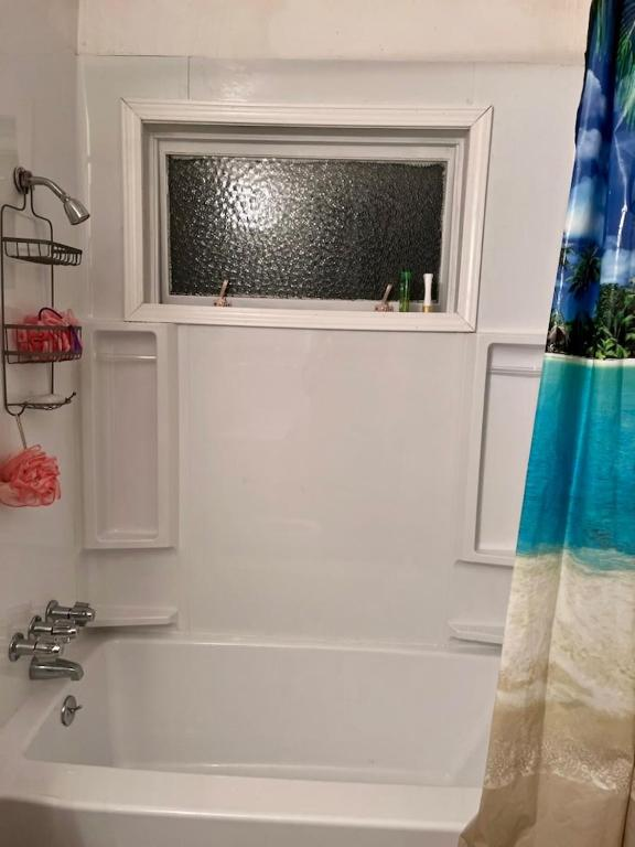 Two double beds with blue and yellow curtains, East 16th Avenue Anchorage