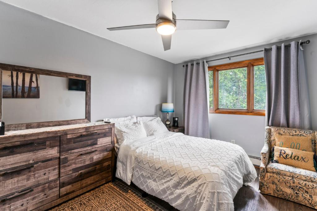 Two double beds with blue and yellow curtains, East 16th Avenue Anchorage