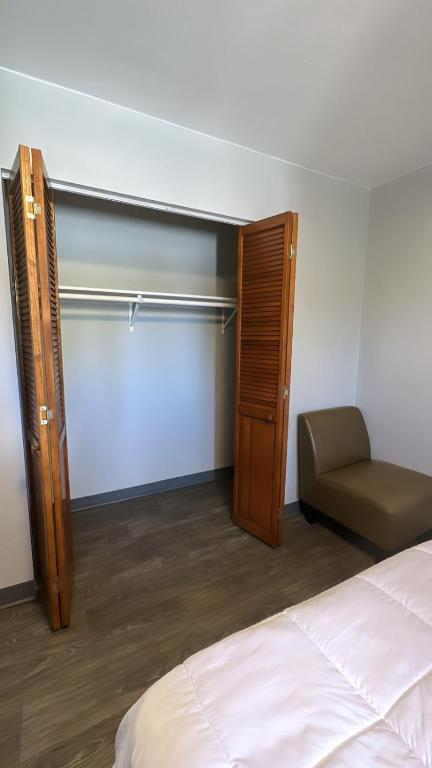 Two double beds with blue and yellow curtains, East 16th Avenue Anchorage