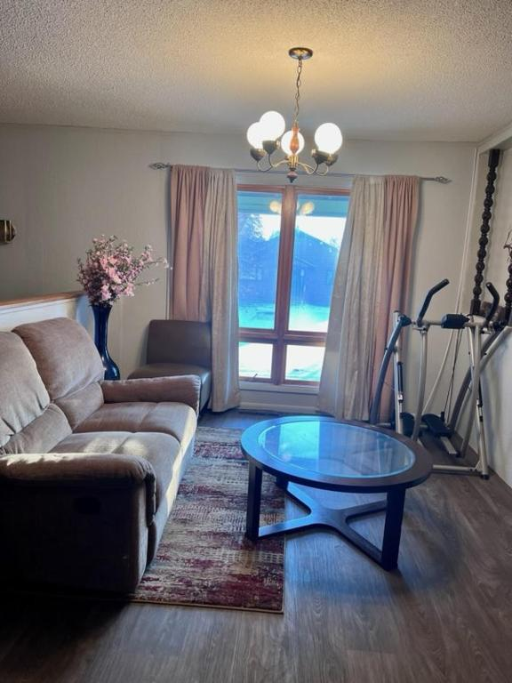 Two double beds with blue and yellow curtains, East 16th Avenue Anchorage