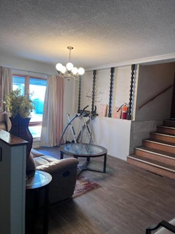 Two double beds with blue and yellow curtains, East 16th Avenue Anchorage