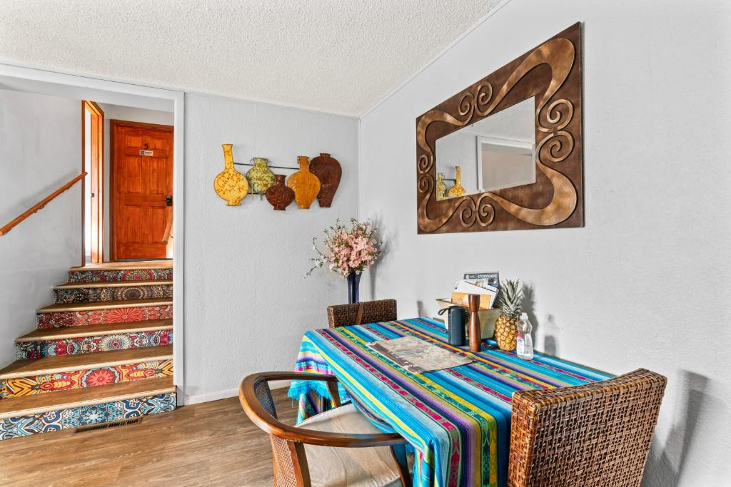 Living room with patterned tile staircase, ShaligoHomes Sunset Room, Anchorage