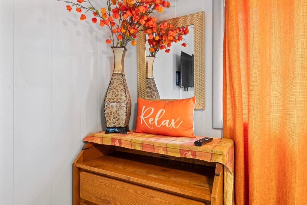 Bedroom with open closet and floral art, Simple And Orange Deluxe, Anchorage