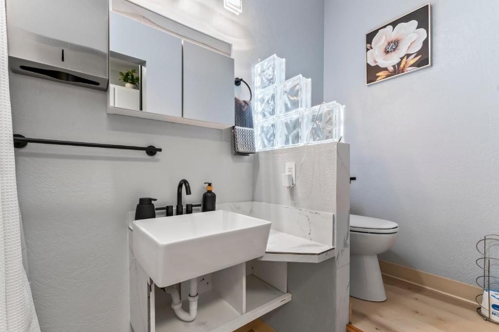 Bathroom with coin-op laundry access, Stylish Studio Suite, East 16th Avenue