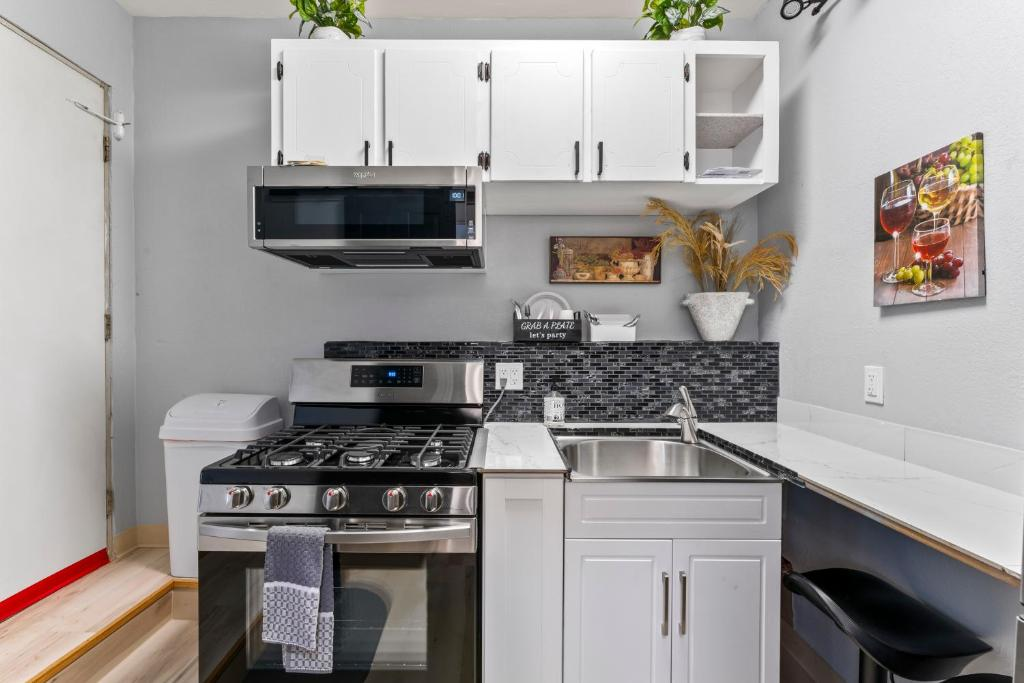 Barn door opening to kitchenette, studio suite near downtown Anchorage