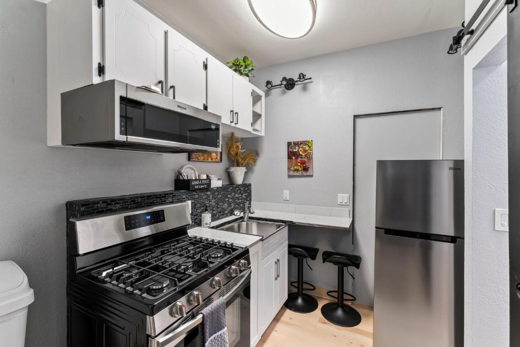 Barn door opening to kitchenette, studio suite near downtown Anchorage